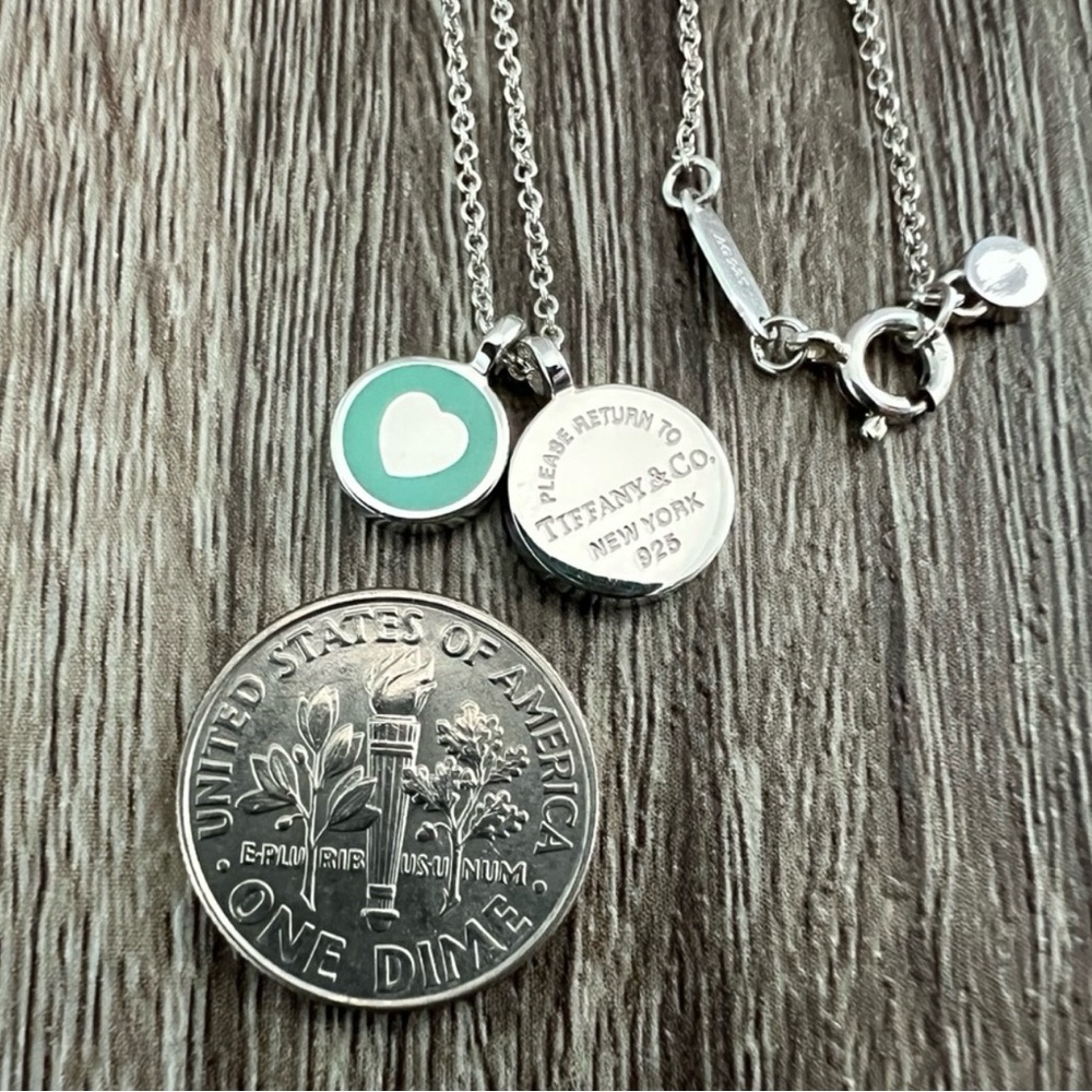 Tiffany & Co. blue enamel circle with heart cut out